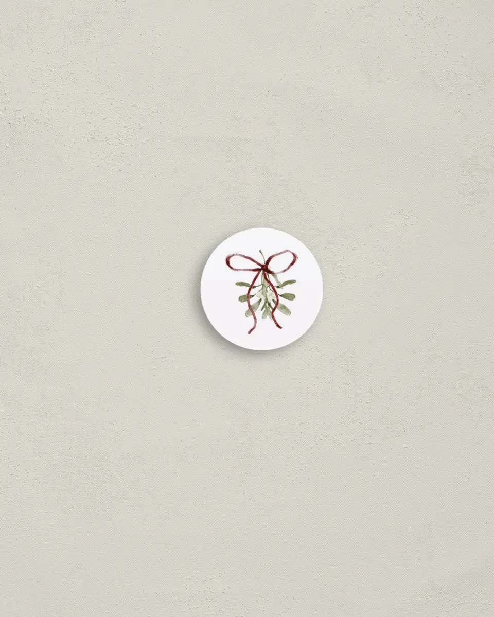 This is a 1¼" circle Envelope Seal called Mistletoe Moments printed in full color