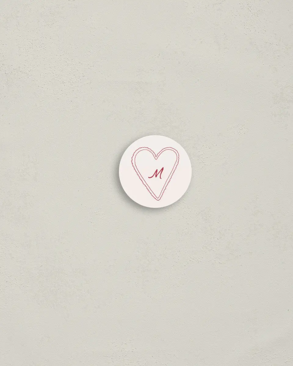 This is a 1¼" circle Envelope Seal called Heart On My Sleeve printed in full color