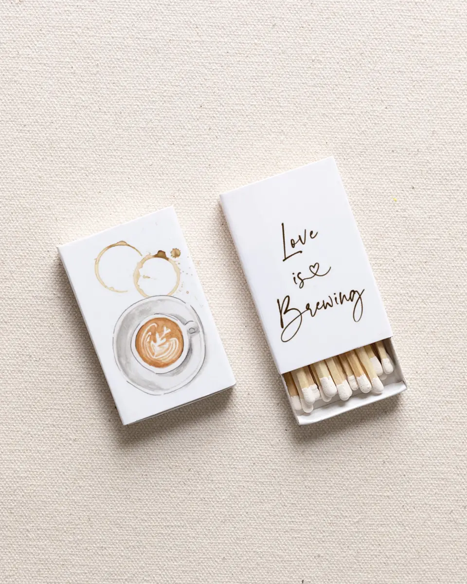 This is a 2.25" x 1.409" x .4" Wedding Matche called Love is Brewing printed in full color with Gold foil