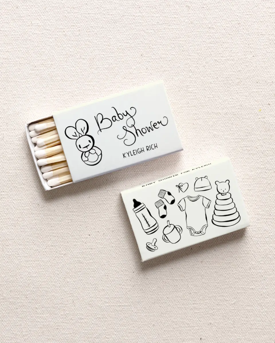 This is a 2.25" x 1.409" x .4" Wedding Matche called Darling Doodle printed in full color with Gold foil