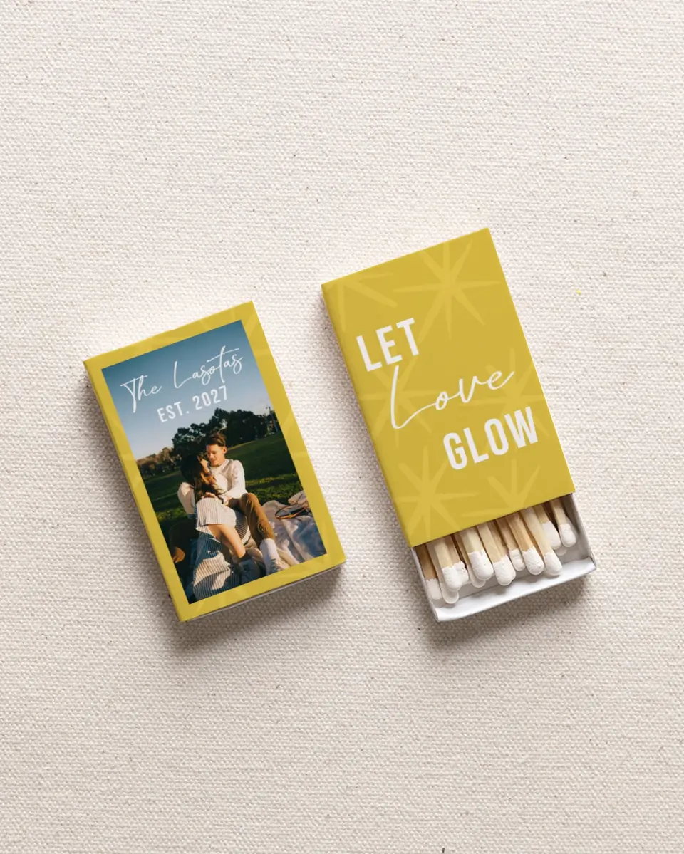 This is a 2.25" x 1.409" x .4" Wedding Matche called Let Love Glow printed in full color with Gold foil