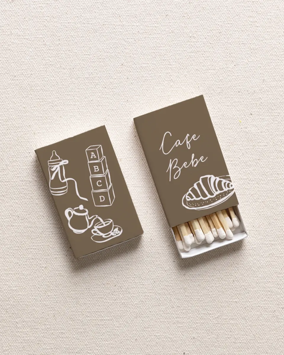 This is a 2.25" x 1.409" x .4" Wedding Matche called Cafe Bebe printed in full color with Gold foil
