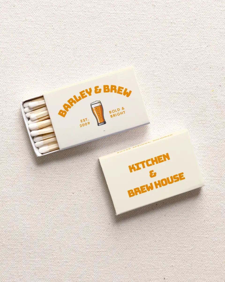 This is a 2.25" x 1.409" x .4" Business Matche called Barley & Brew printed in full color with Rose Gold foil