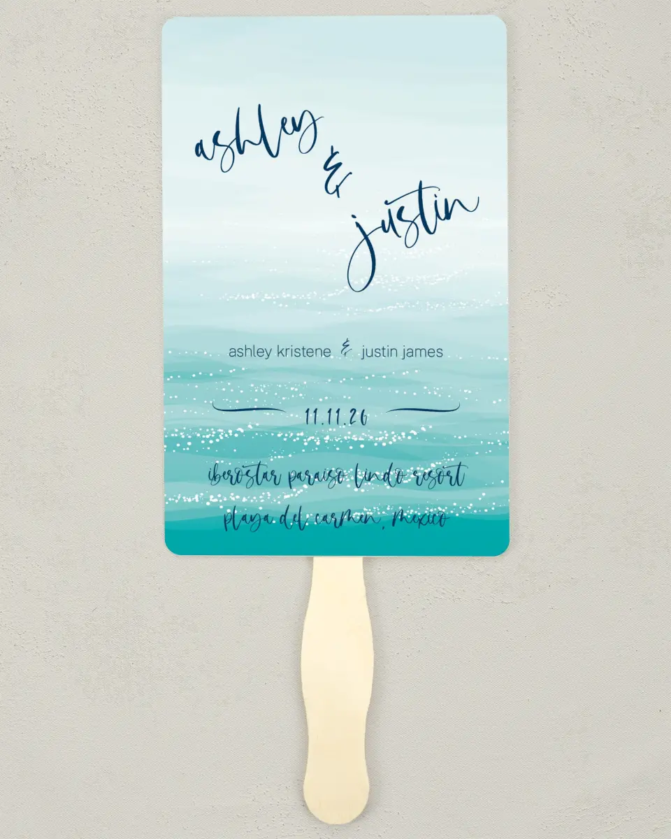 This is a 5" x 7⅞" Wedding Program Fan called Beyond the Shore printed in full color with Silver foil on Luxe Satin (coated) paper