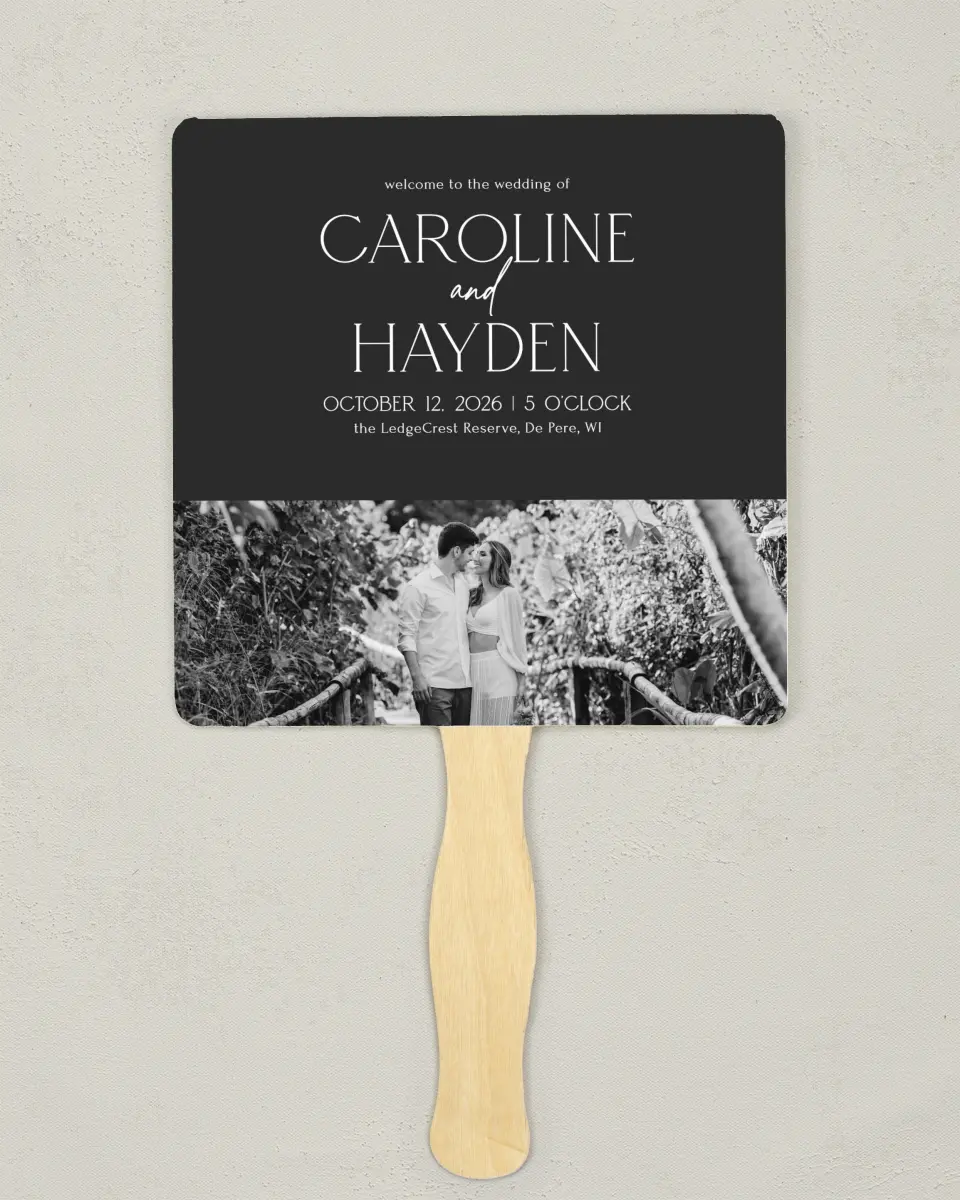 This is a 6¼" x 6¼" Wedding Program Fan called The Caroline printed in full color with Silver foil on Luxe Satin (coated) paper