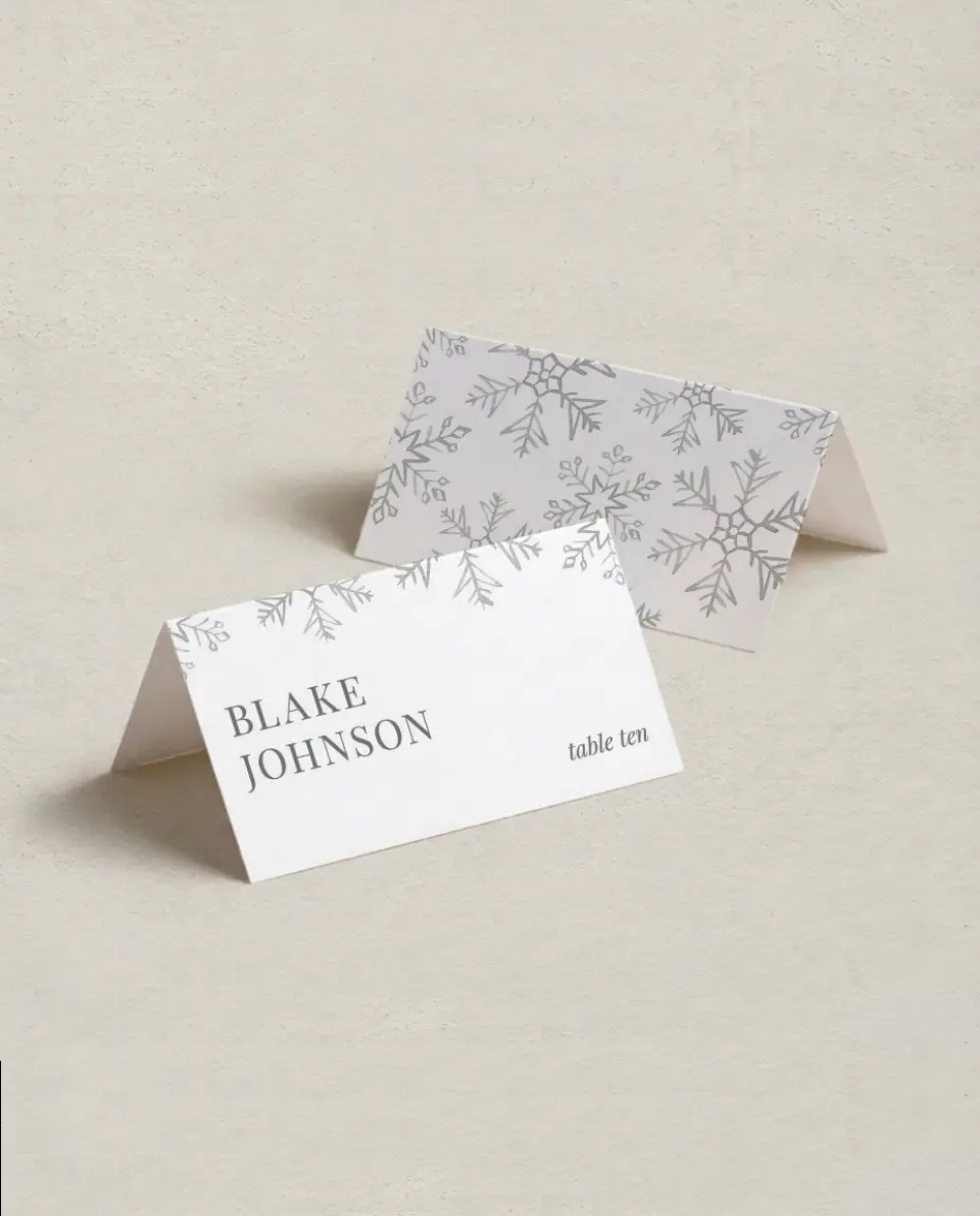 This is a 3½" x 2" Folded Wedding Place Card called Sweet Snowflakes printed in full color on Premium Smooth paper