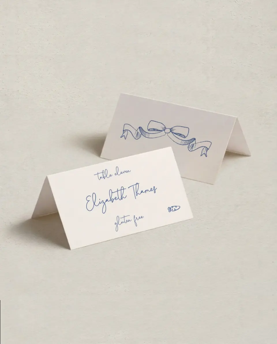 This is a 3½" x 2" Folded Wedding Place Card called Sketched Bow printed in full color on Premium Smooth paper