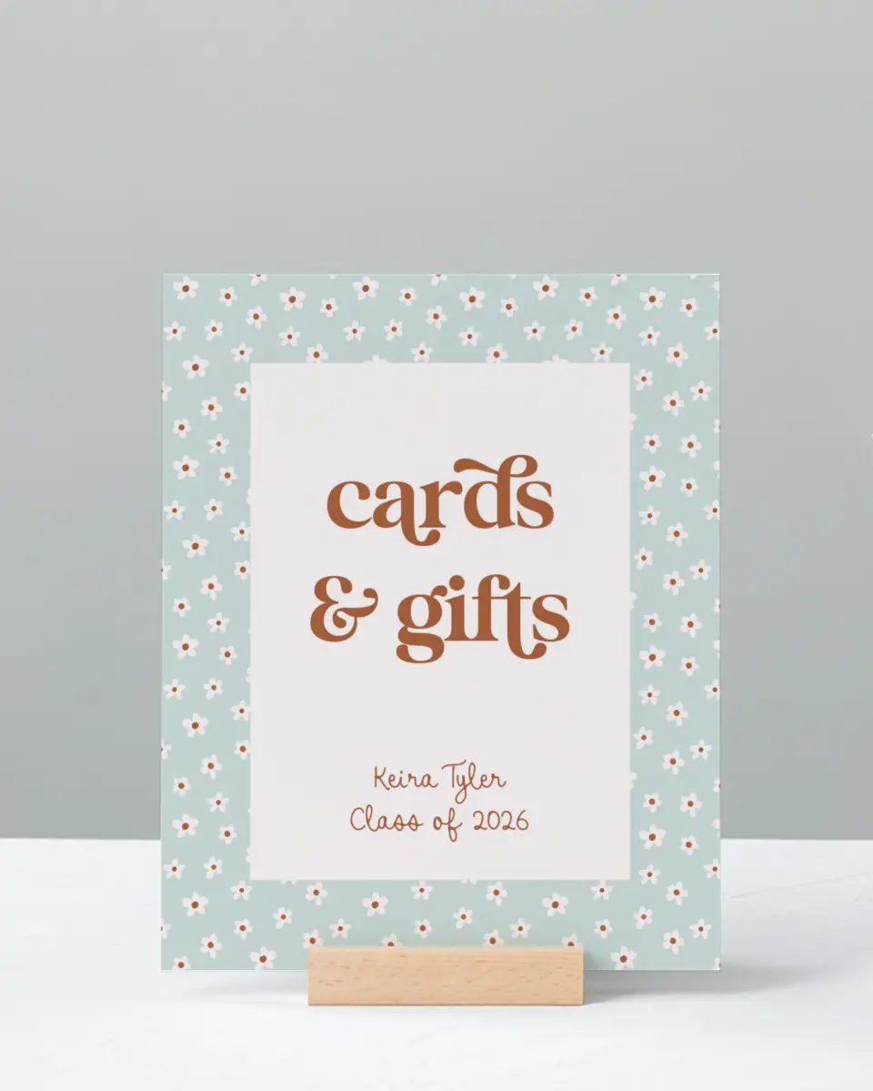 This is a 8" x 10" Cards & Gifts Grad Sign called Demure Daisies printed in full color
