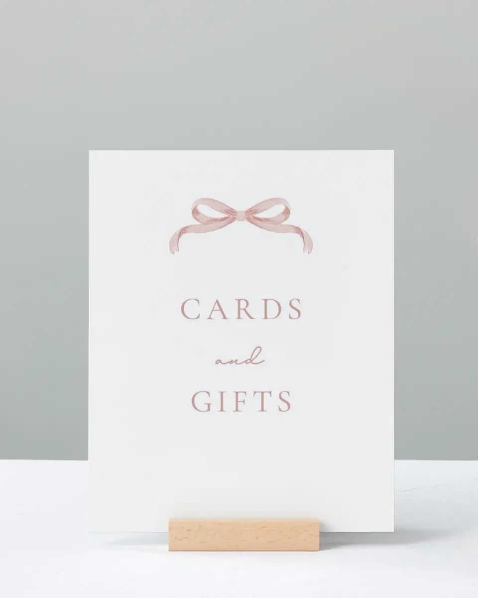 This is a 8" x 10" Cards & Gifts Baby Shower Sign called Bitty Bow printed in full color
