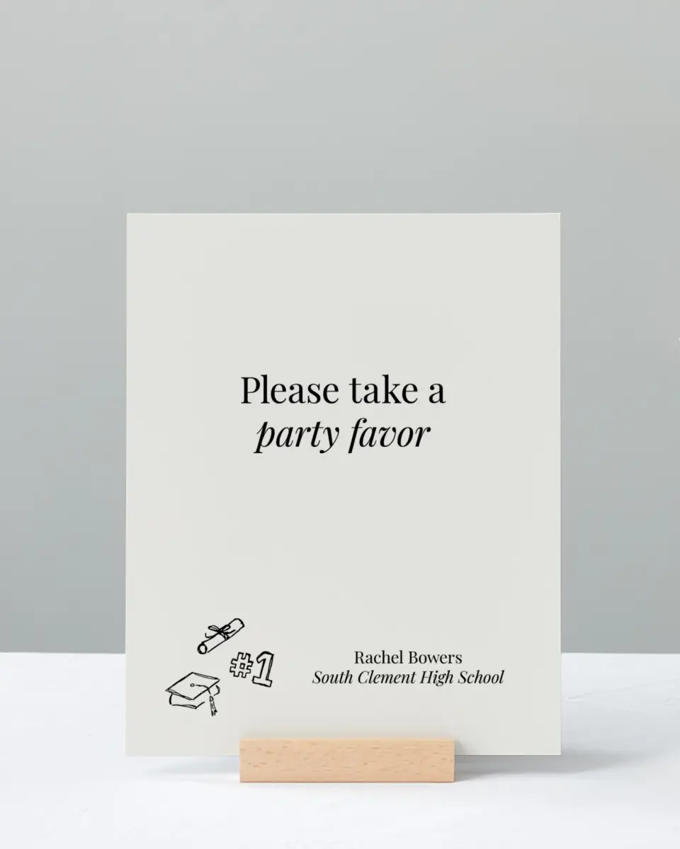 This is a 8" x 10" Take a Favor Grad Sign called Art of Achievement printed in full color with Silver foil