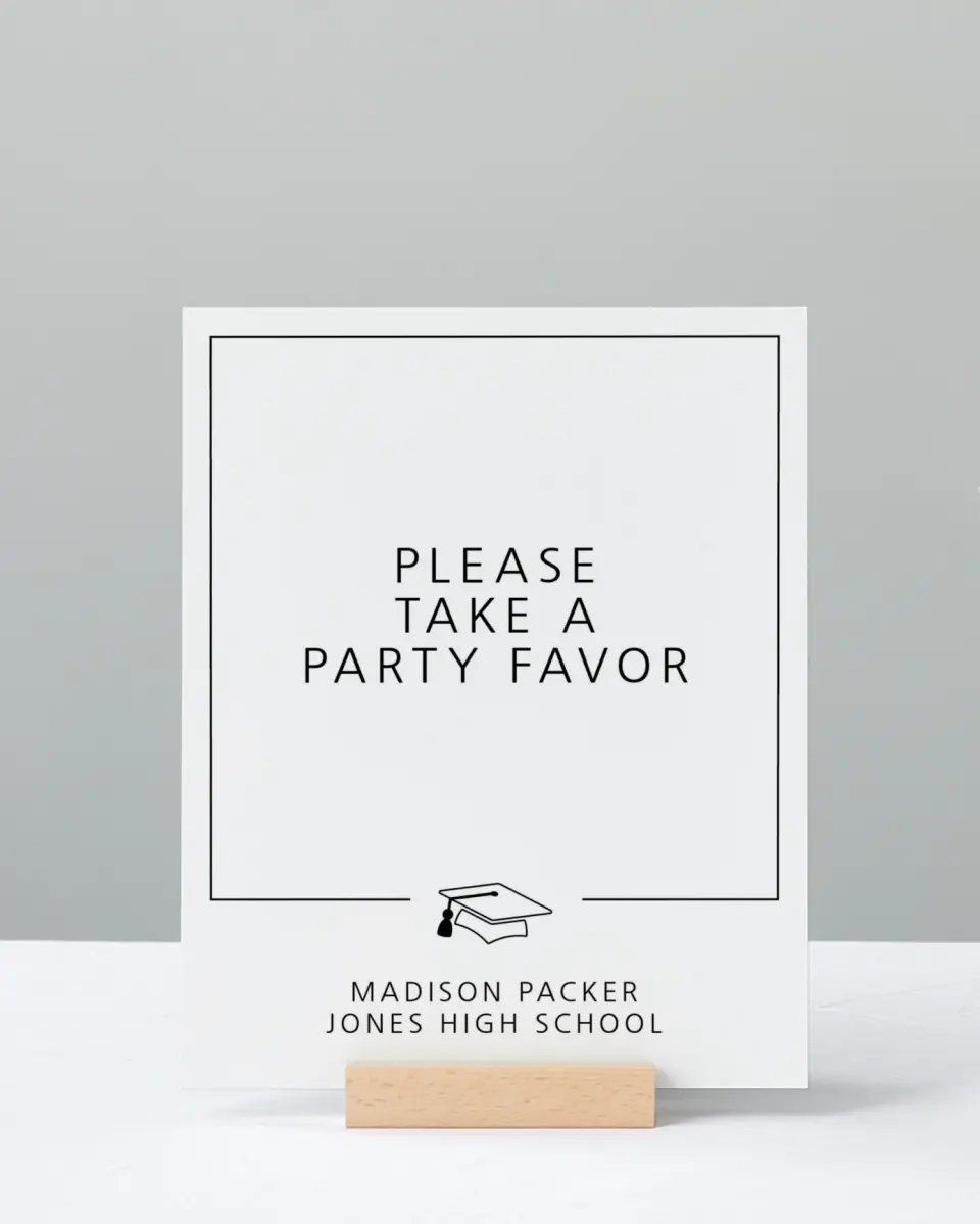 This is a 8" x 10" Take a Favor Grad Sign called Modern Grad printed in full color with Silver foil