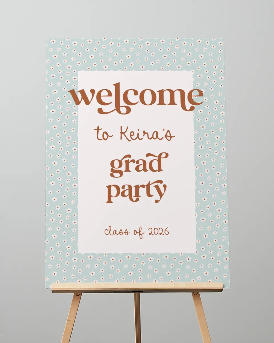 This is a 20" x 28" Welcome Grad Sign called Demure Daisies printed in full color with Rose Gold foil
