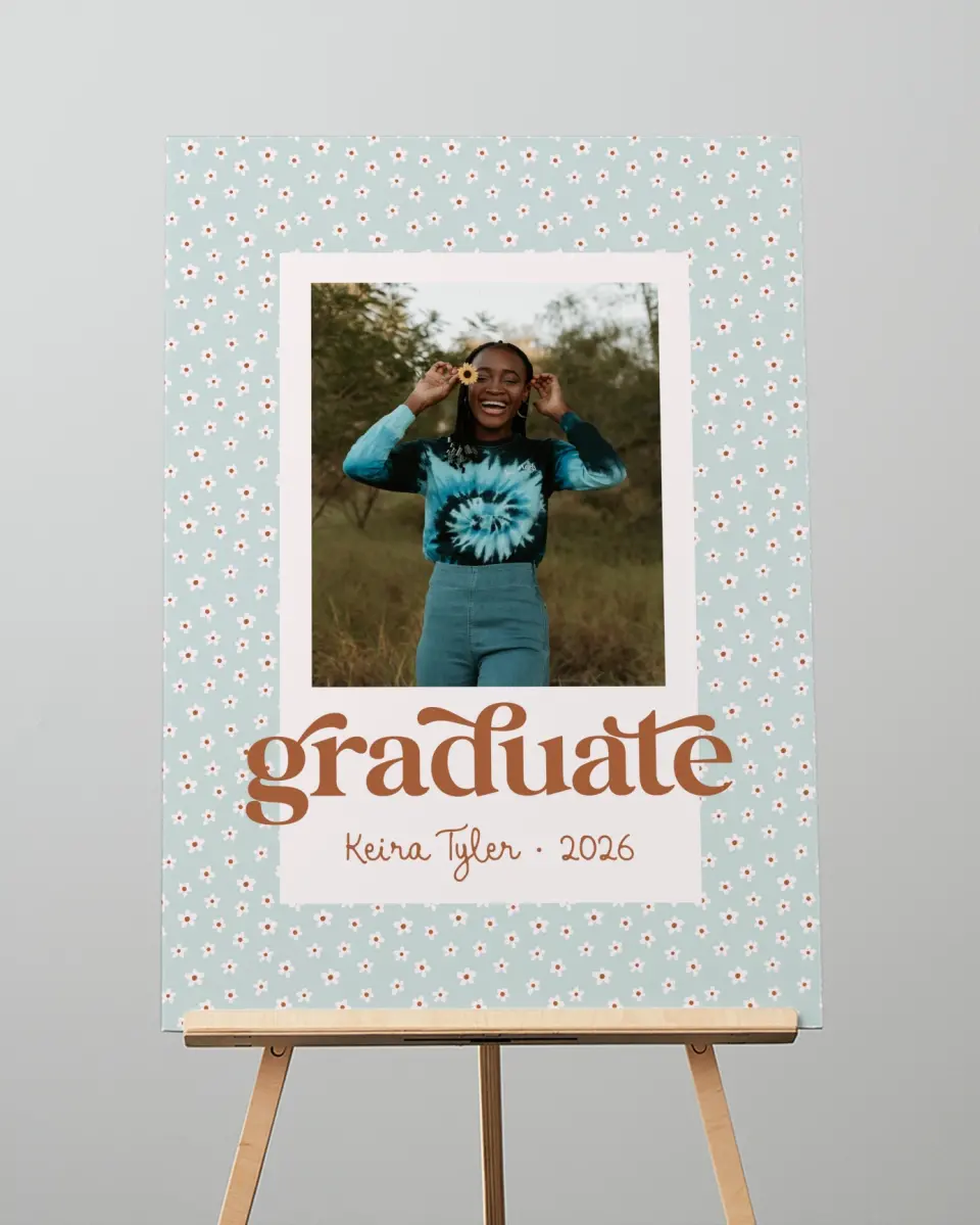 This is a 20" x 28" Welcome Grad Sign called Demure Daisies printed in full color with Rose Gold foil