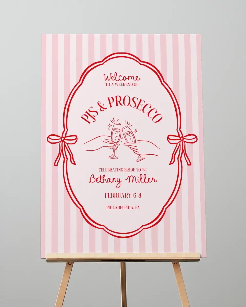 This is a 20" x 28" Welcome Sign called PJs & Prosecco printed in full color with Rose Gold foil