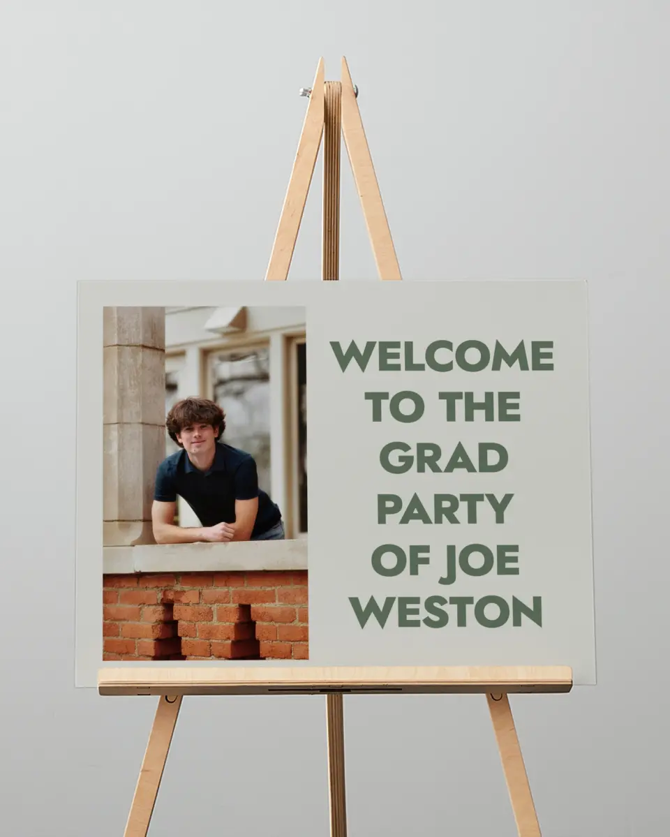 This is a 16" x 20" Welcome Grad Sign called Celebrating the Grad printed in full color with Silver foil