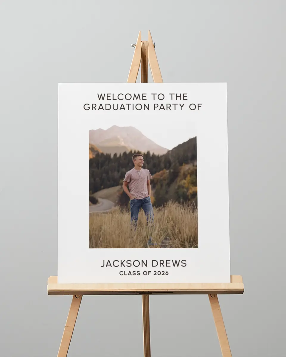 This is a 16" x 20" Welcome Grad Sign called Simple Graduate printed in full color with Silver foil