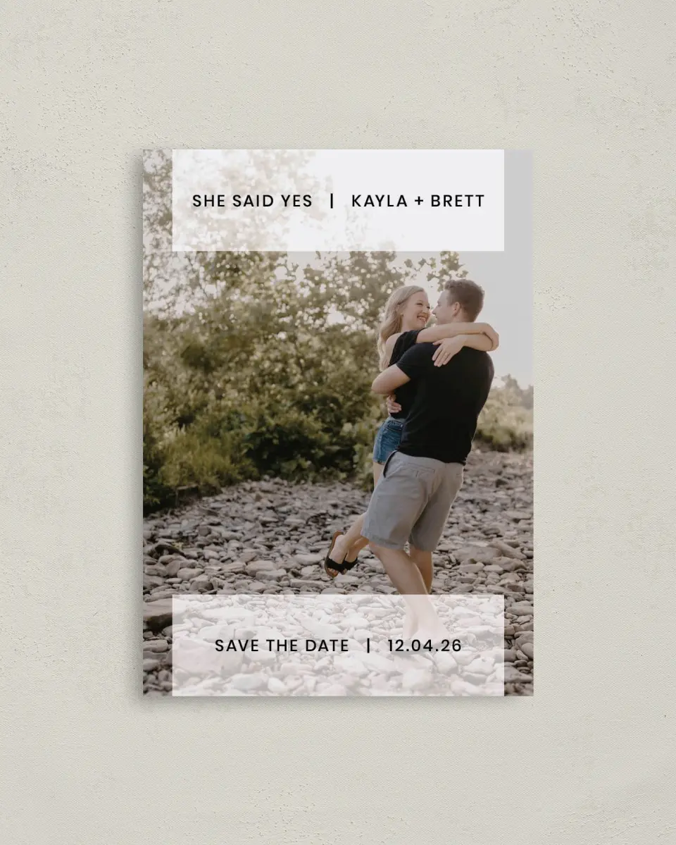 This is a 4" x 5.6" Save the Date Postcard called Carried Away printed in full color with Rose Gold foil on Soft Touch Finish paper