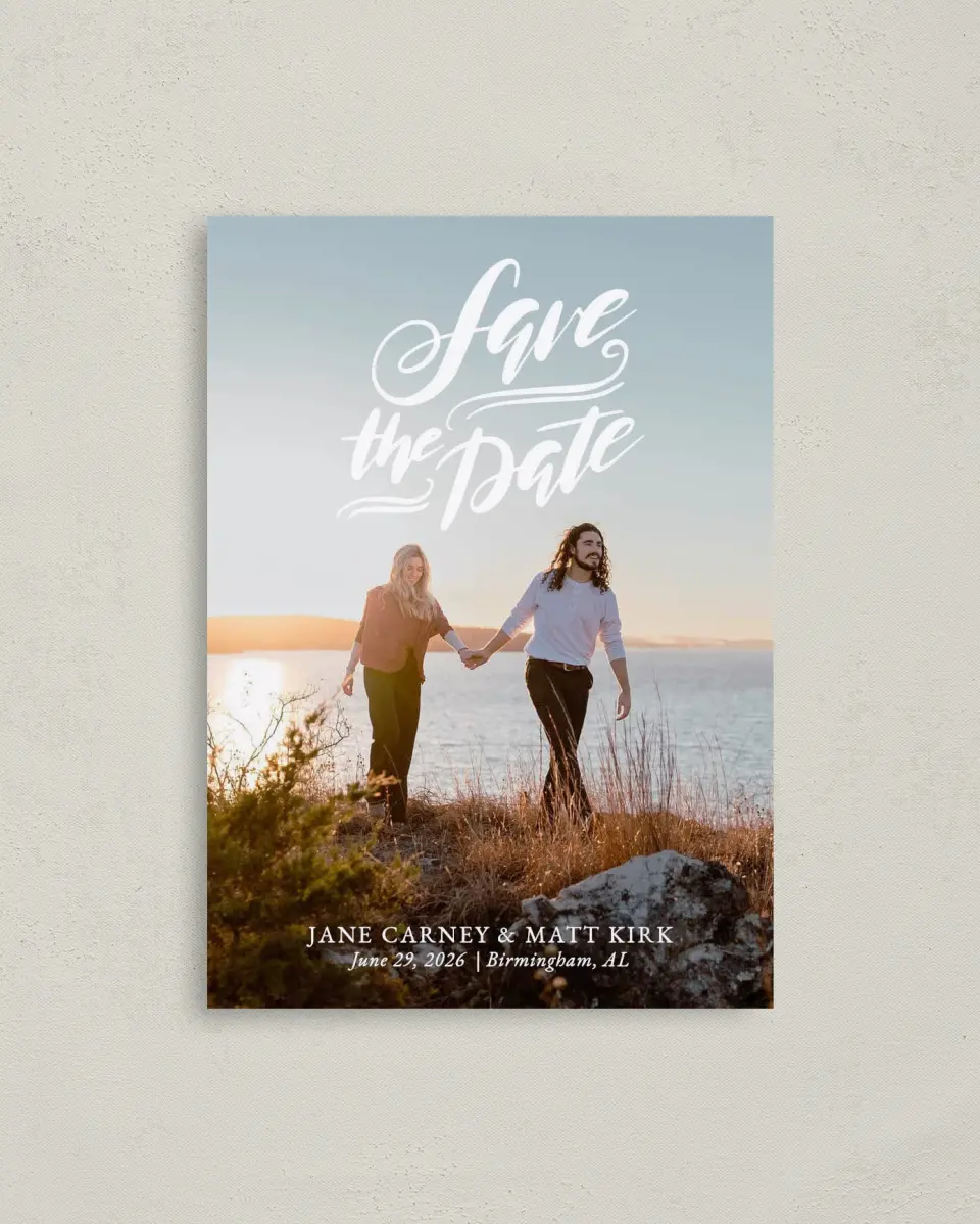 This is a 4" x 5.6" Save the Date Postcard called Rooftop Romance printed in full color with Rose Gold foil on Soft Touch Finish paper