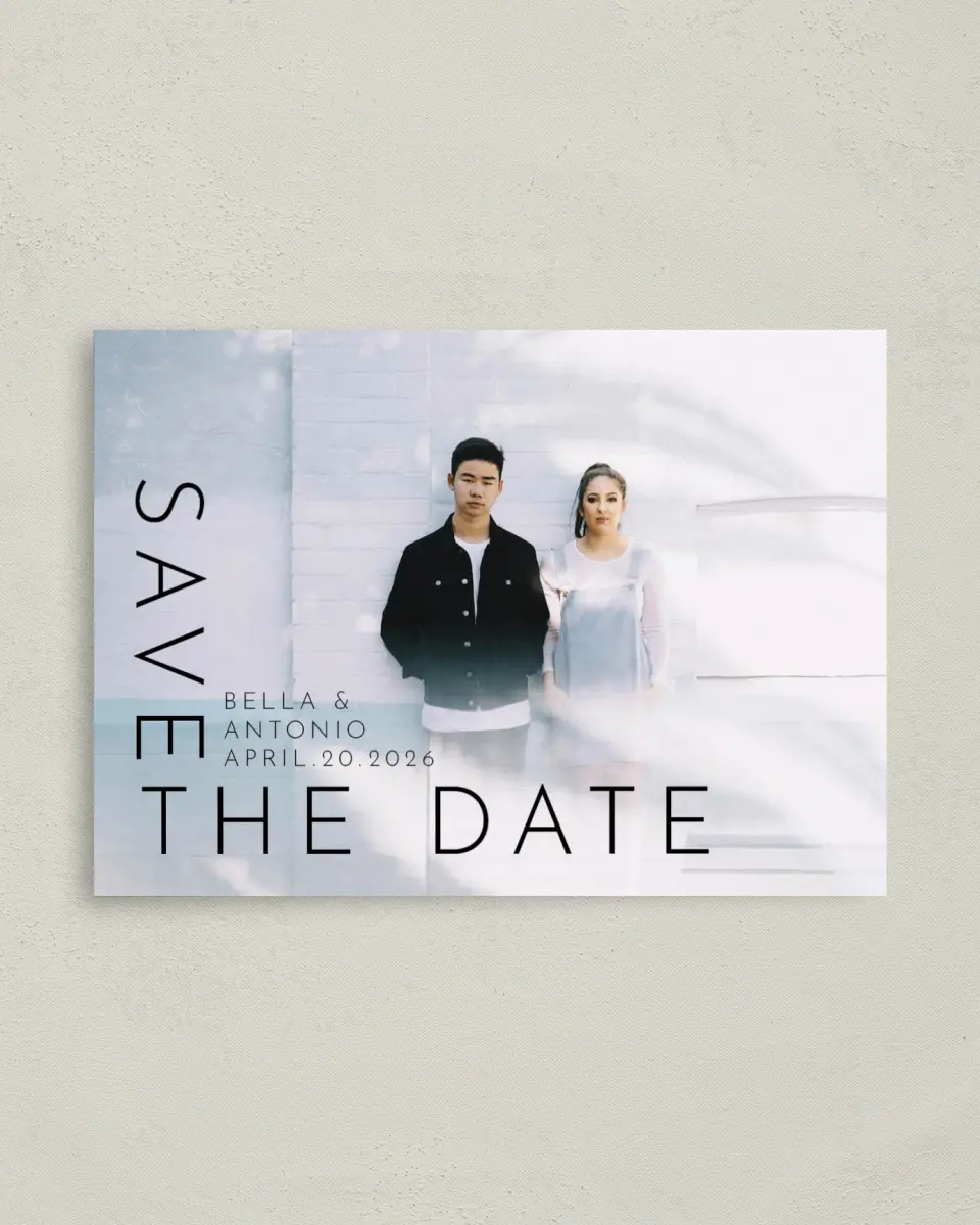 This is a 4" x 5.6" Save the Date Postcard called Cornered By Love printed in full color on Soft Touch Finish paper