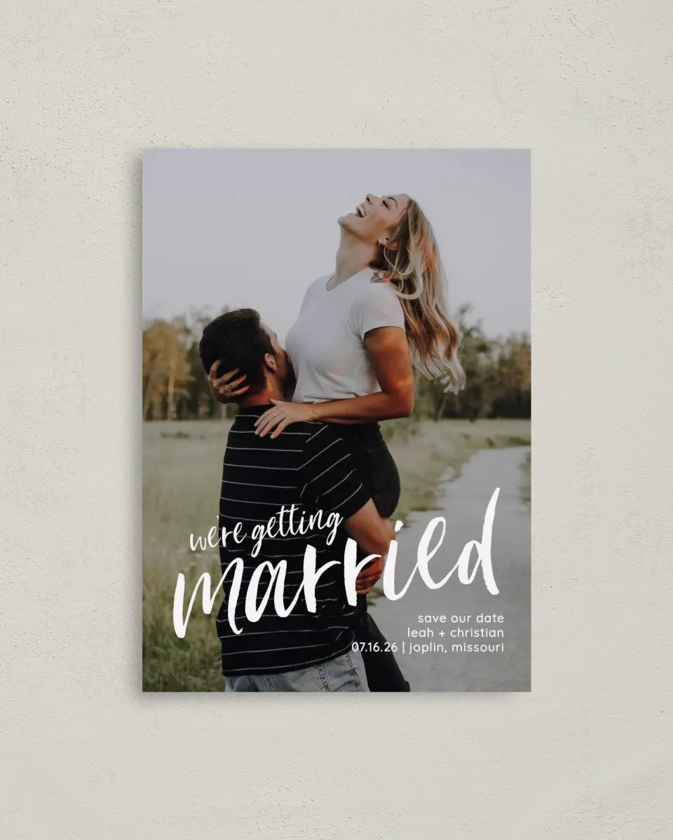 This is a 4" x 5.6" Save the Date Postcard called Exciting News printed in full color on Soft Touch Finish paper