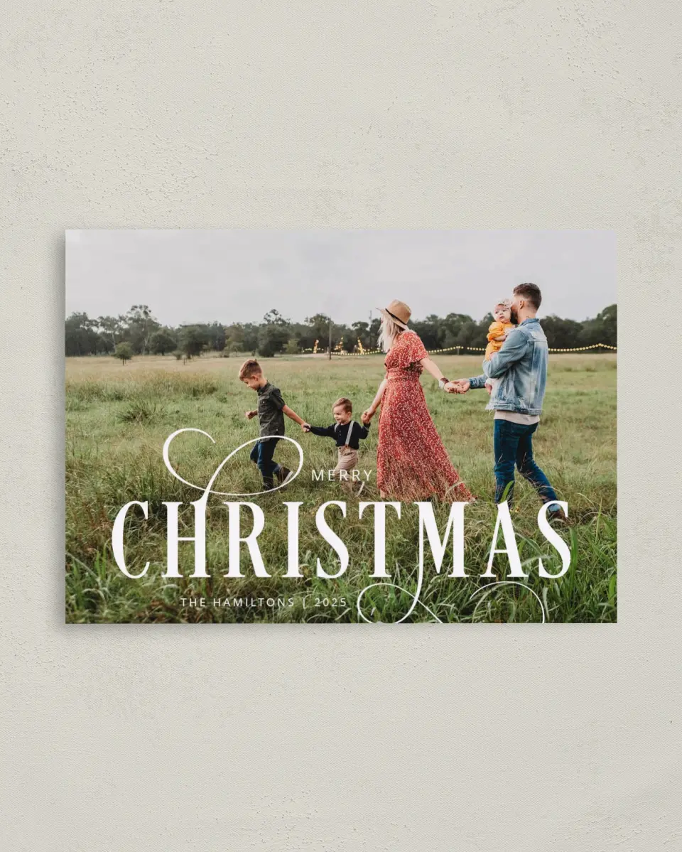 This is a 4" x 5.6" Christmas Card called Infinite Christmas printed in full color with Rose Gold foil on Soft Suede (coated) paper