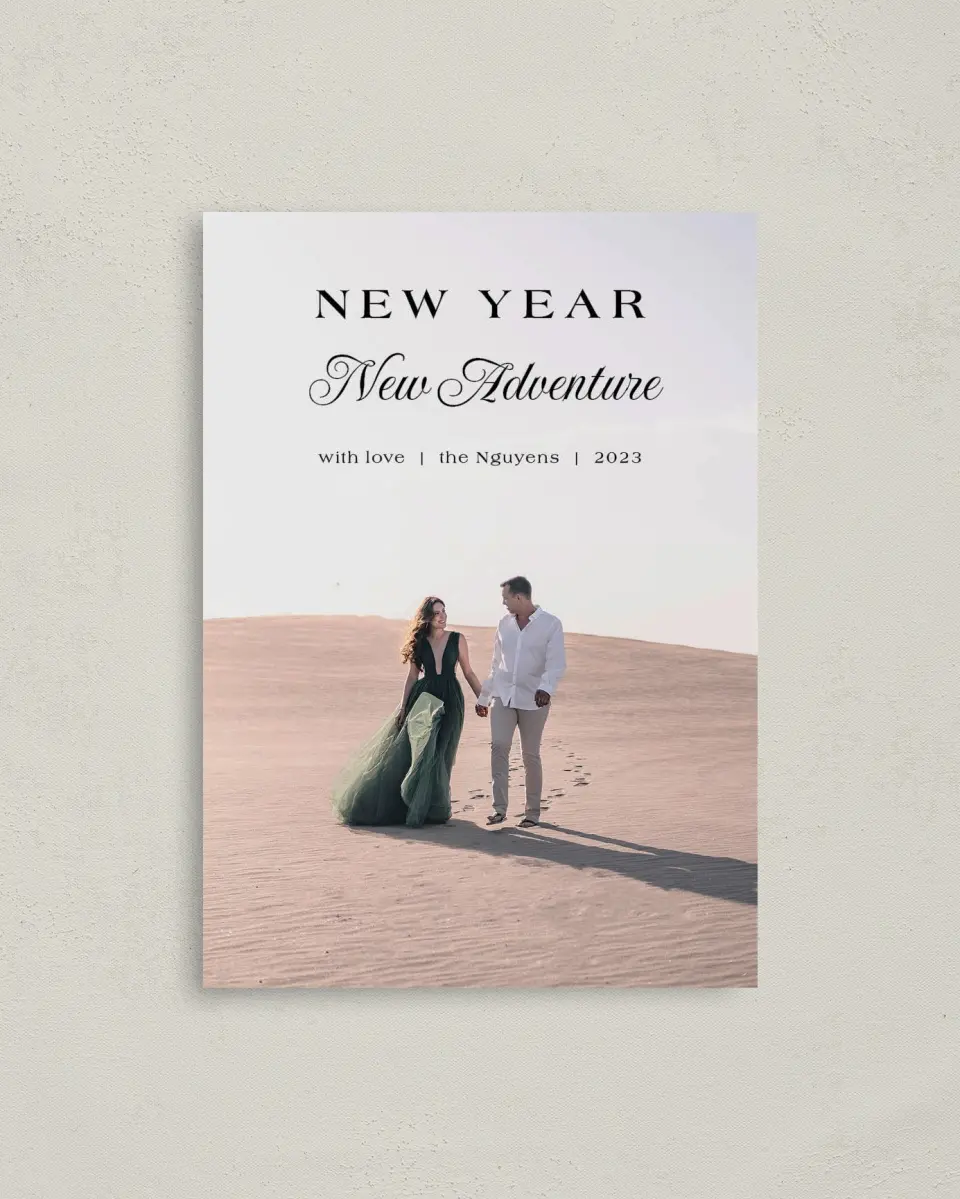 This is a 4" x 5.6" Christmas Card called Year of Adventure printed in full color with Rose Gold foil on Soft Suede (coated) paper
