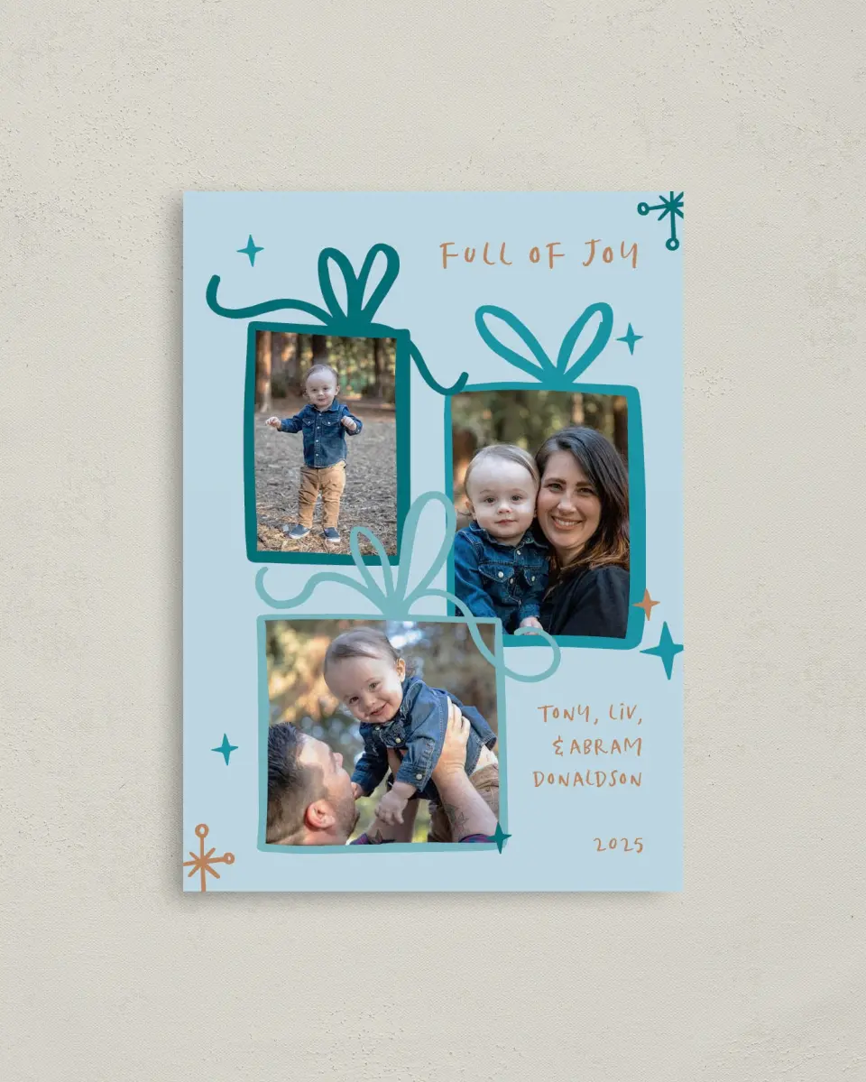 This is a 4" x 5.6" Christmas Card called Whimsical Gifts printed in full color with Rose Gold foil on Soft Suede (coated) paper