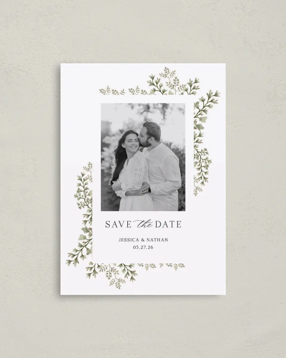 This is a 4" x 5.6" Save the Date Postcard called Leaves of Love printed in full color with Rose Gold foil on Soft Touch Finish paper