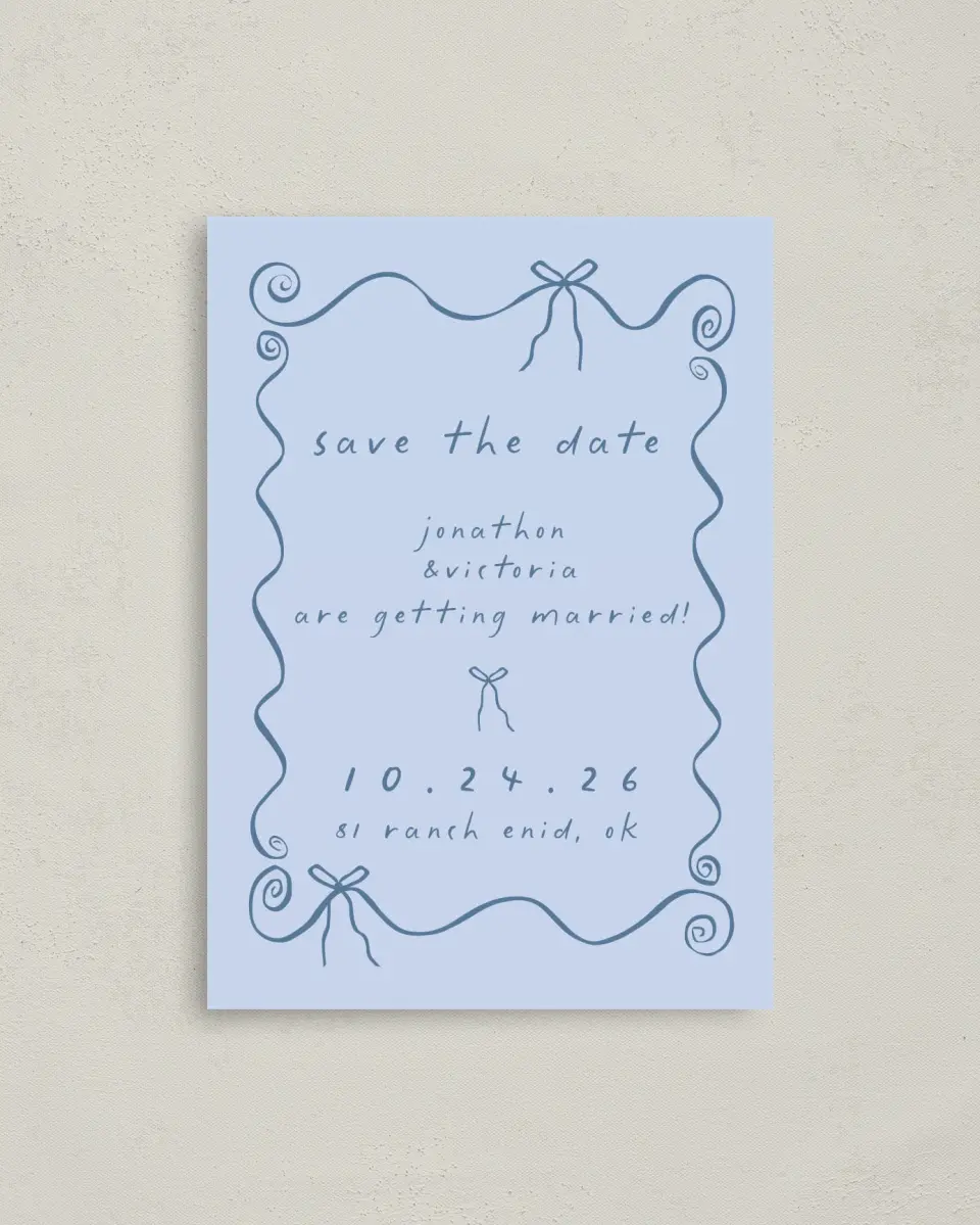 This is a 4" x 5.6" Save the Date Postcard called Ribbon Kisses printed in full color on Soft Touch Finish paper
