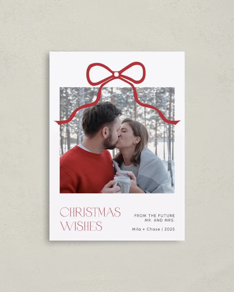 This is a 4" x 5.6" Christmas Card called Winter Ribbon Romance printed in full color with Rose Gold foil on Soft Suede (coated) paper