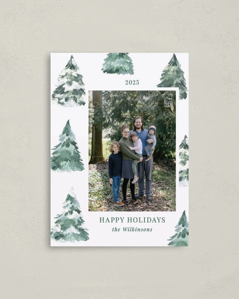 This is a 4" x 5.6" Christmas Card called Frosted Forest printed in full color with Rose Gold foil on Soft Suede (coated) paper