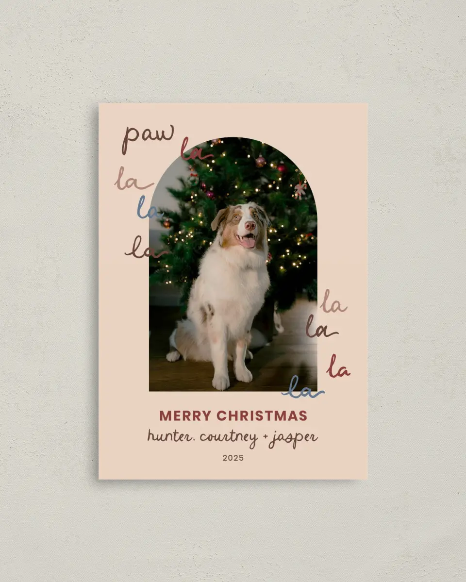 This is a 4" x 5.6" Christmas Card called Paw La La La La printed in full color with Rose Gold foil on Soft Suede (coated) paper