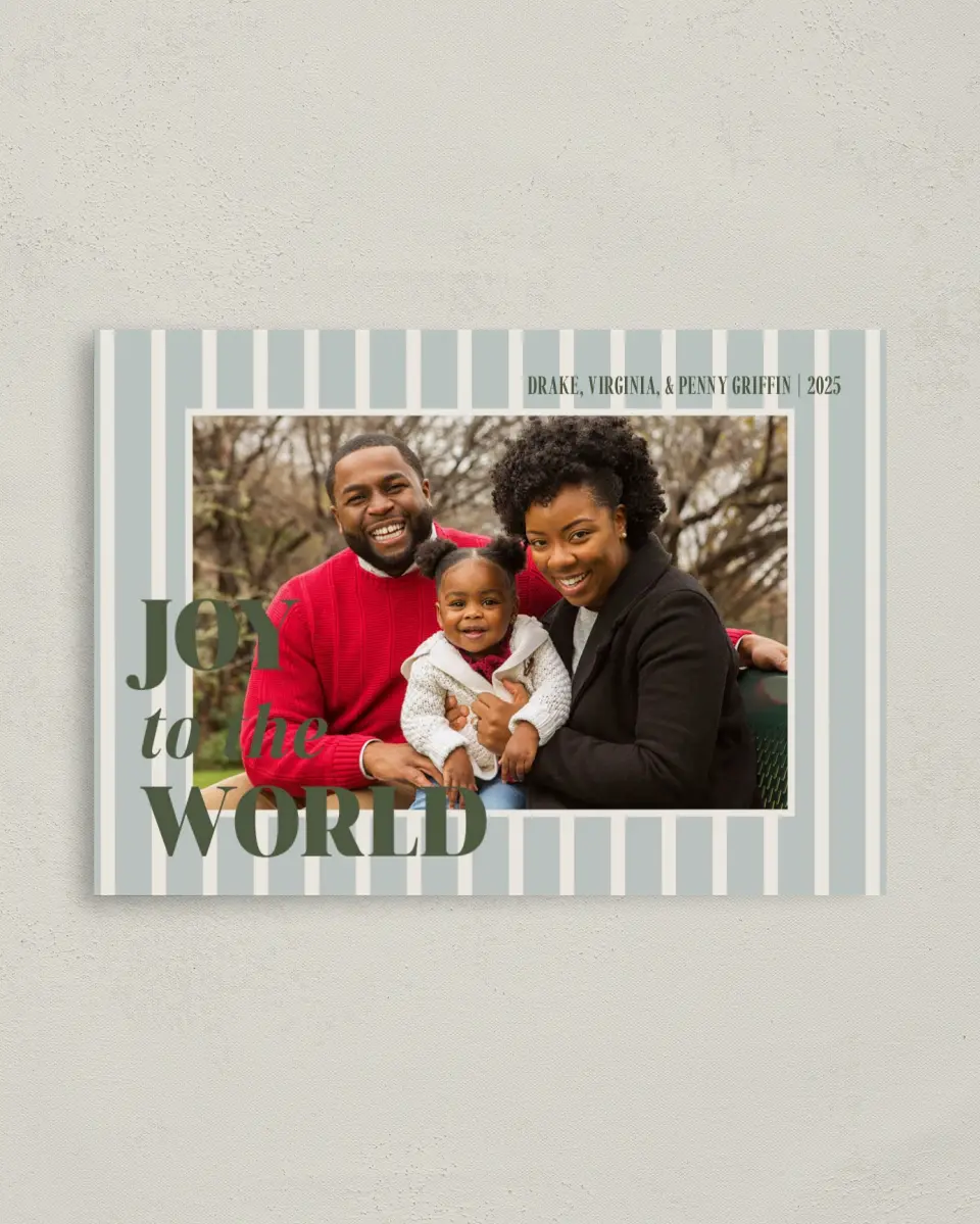 This is a 4" x 5.6" Christmas Card called Joy and Love printed in full color with Rose Gold foil on Soft Suede (coated) paper