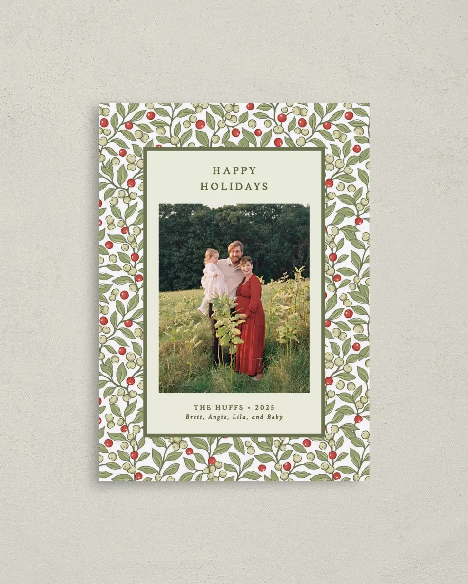 This is a 4" x 5.6" Christmas Card called Holiday Holly printed in full color with Rose Gold foil on Soft Suede (coated) paper
