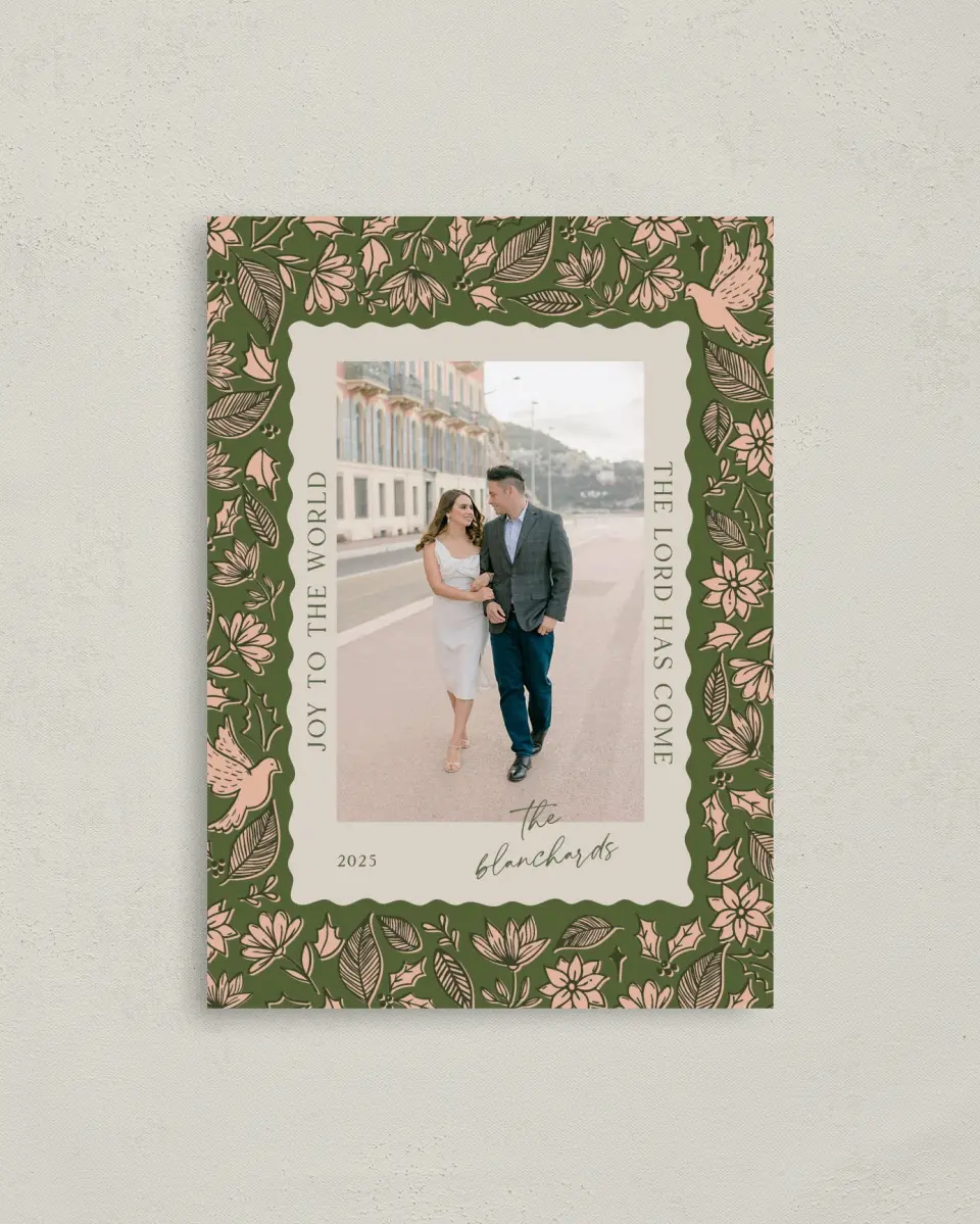 This is a 4" x 5.6" Christmas Card called Peace & Joy printed in full color with Rose Gold foil on Soft Suede (coated) paper