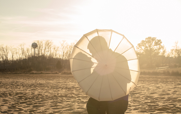 Beach engagement session and photo idea using a parasol 
