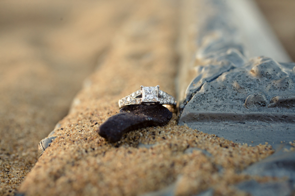 beach e-session photos featuring engagement rings on the beach