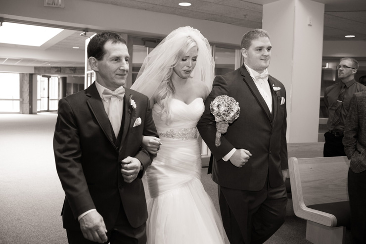 bride being walked up the aisle