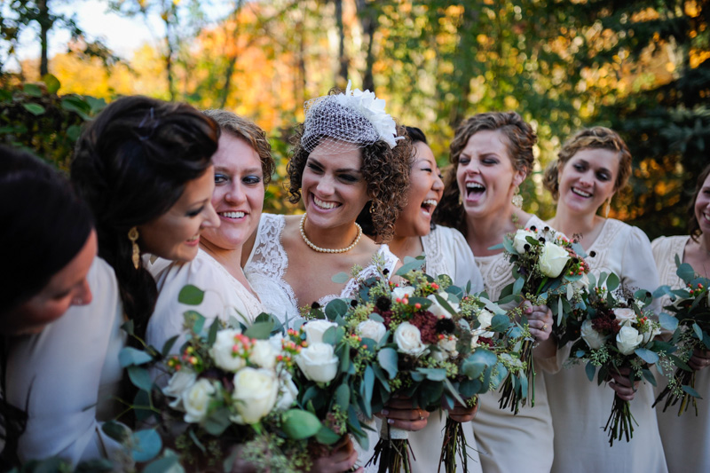 Bridesmaids in ivory sheath dresses