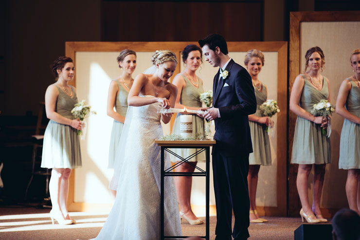 Unity candle lighting in church wedding ceremony