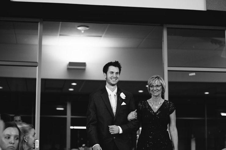 Groom-walking-mother-in-law-down-the-aisle